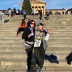 people with arms raised on steps where Rocky Balboa trained at the Rocky Run